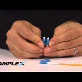 Hands holding LC Fiber Duplex Simplex Connector Conversion HD